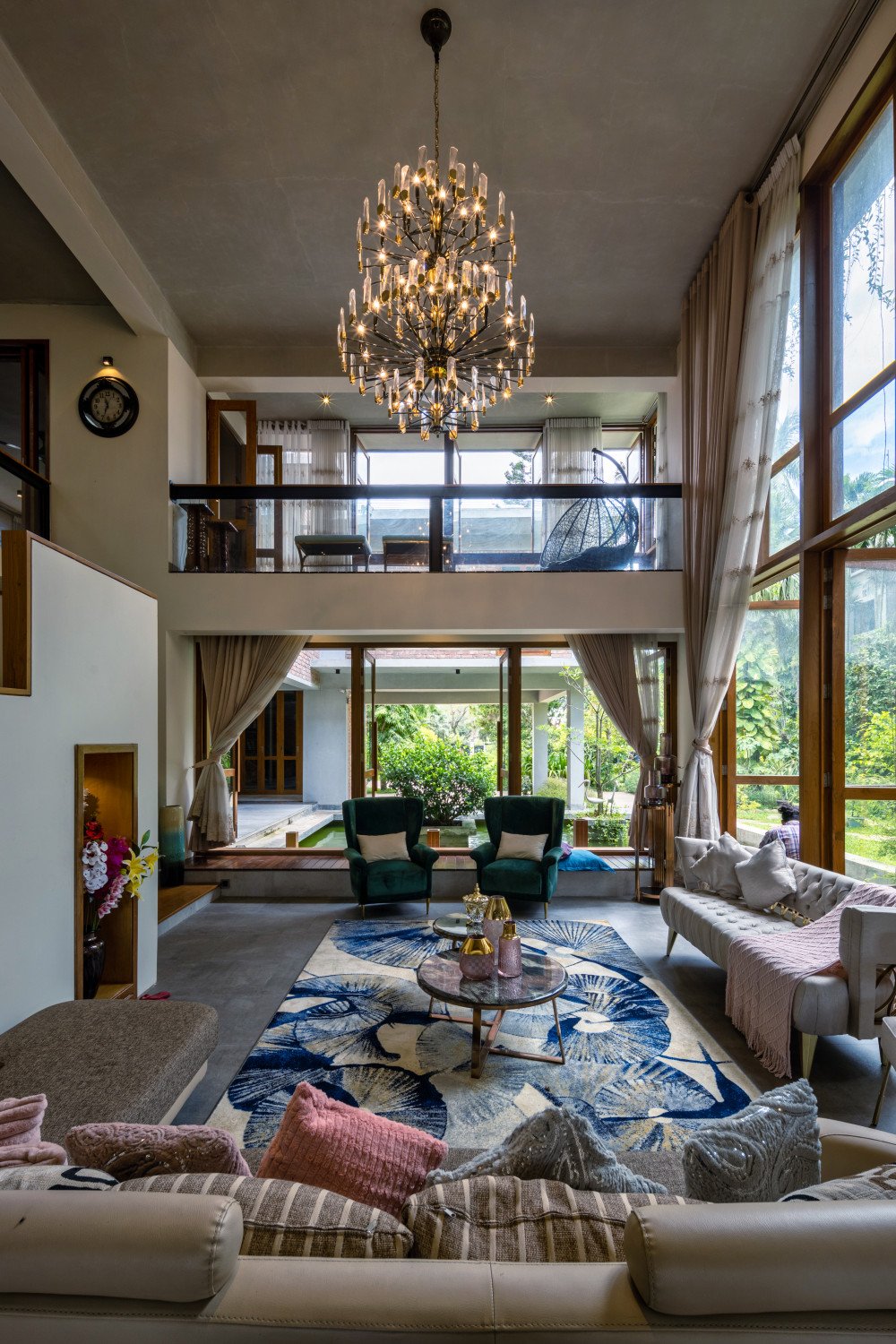 Inside, the double-height living room embodies the homeowners’ lifelong desire for a warm, memory-laden space with no barriers between inside and out.
